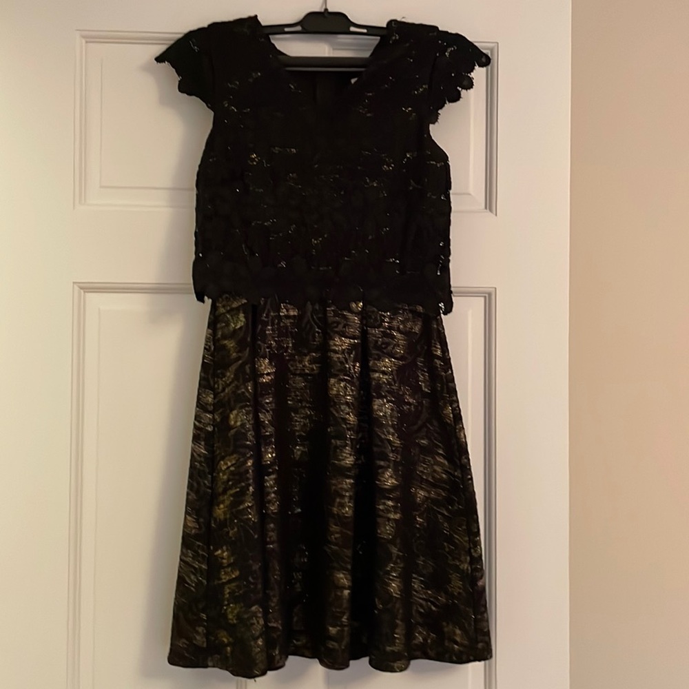 Girls dress size 14, but runs small, color black and gold
